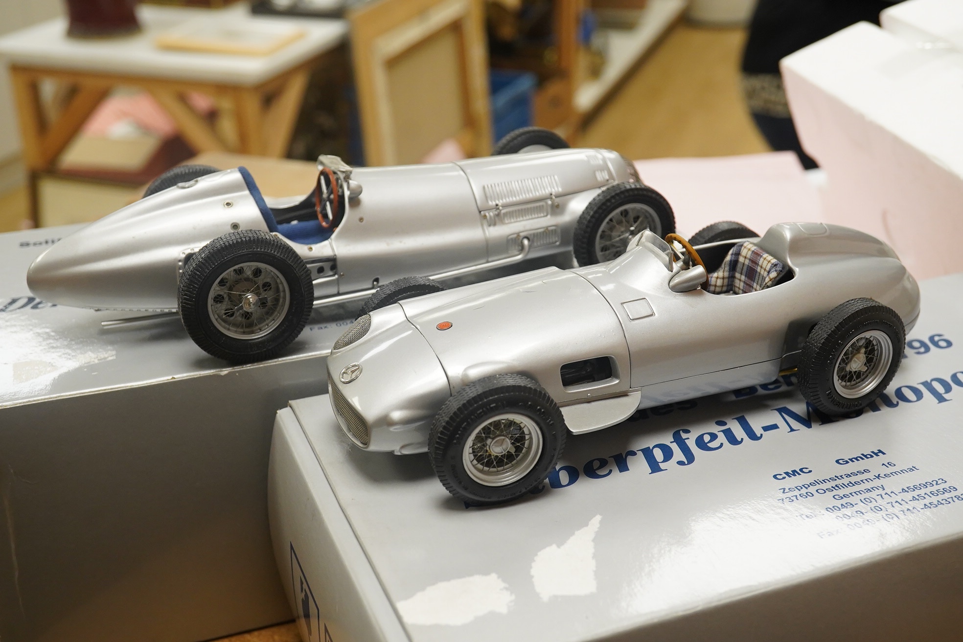 Two boxed CMC 1:18 scale diecast model cars; a Mercedes-Benz W196, together with a Mercedes-Benz W154 1938. Condition - fair to good, and slight metal fatiguing to the bonnet on the W196 as occasionally found with early